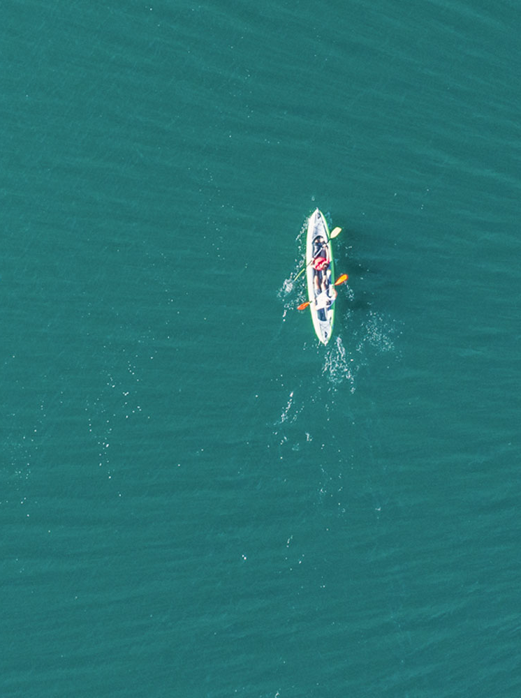 Drone view on the kayak team in the middle of the lake