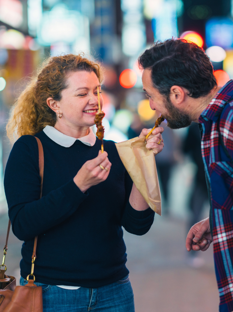 A couple is enjoying street food
