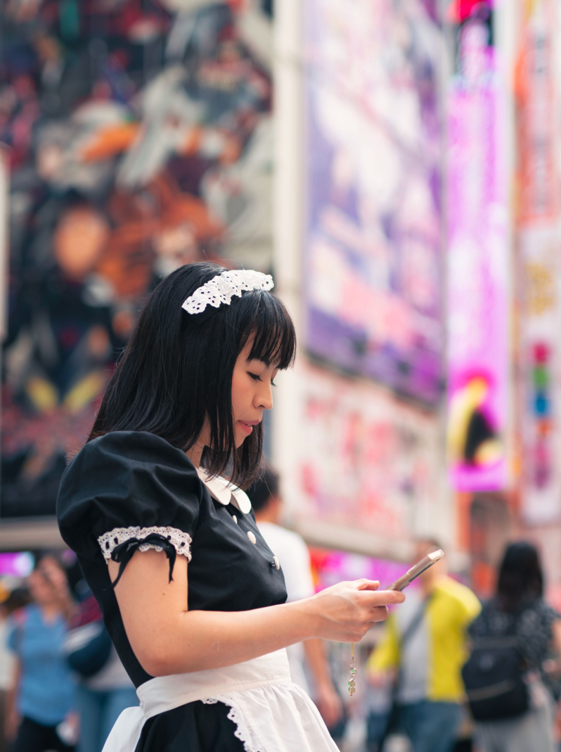 Cosplay housemaid walking on street in Akihabara, the most famous cosplay-culture city in Japan and also in the world