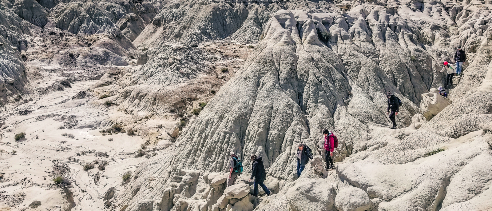 Hikers in La Leona, a petrified forest in Patagonia, Argentina with dinosaur fossils