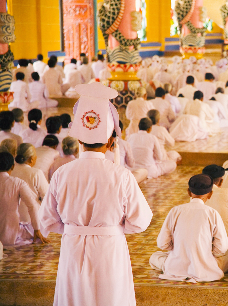 Rows of nuns and monks in Vietnamese temple