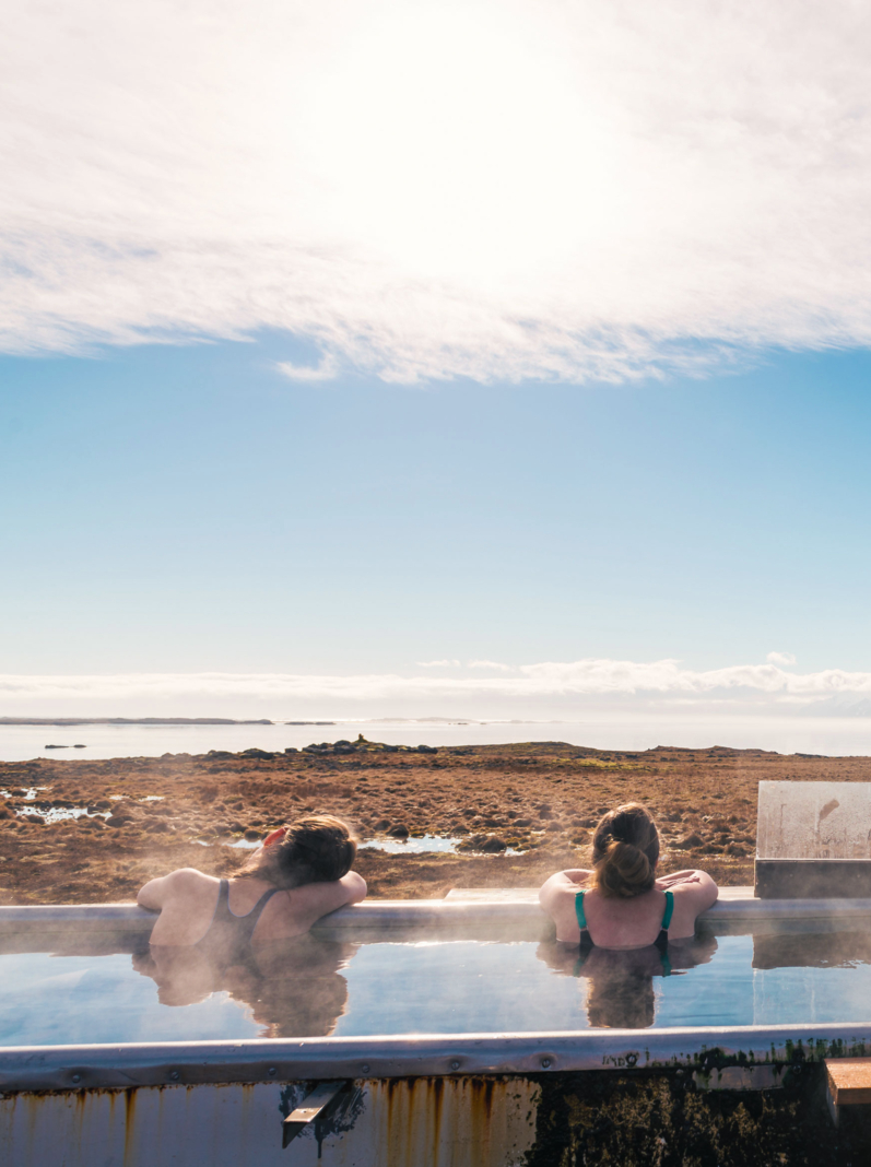 Icelandic hotpot among the amazing lagoon and mountains