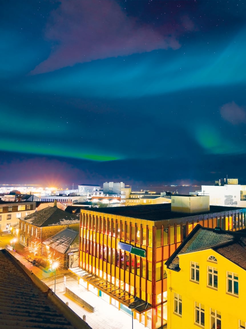 View of the northern light from the city center in Reykjavik, Iceland