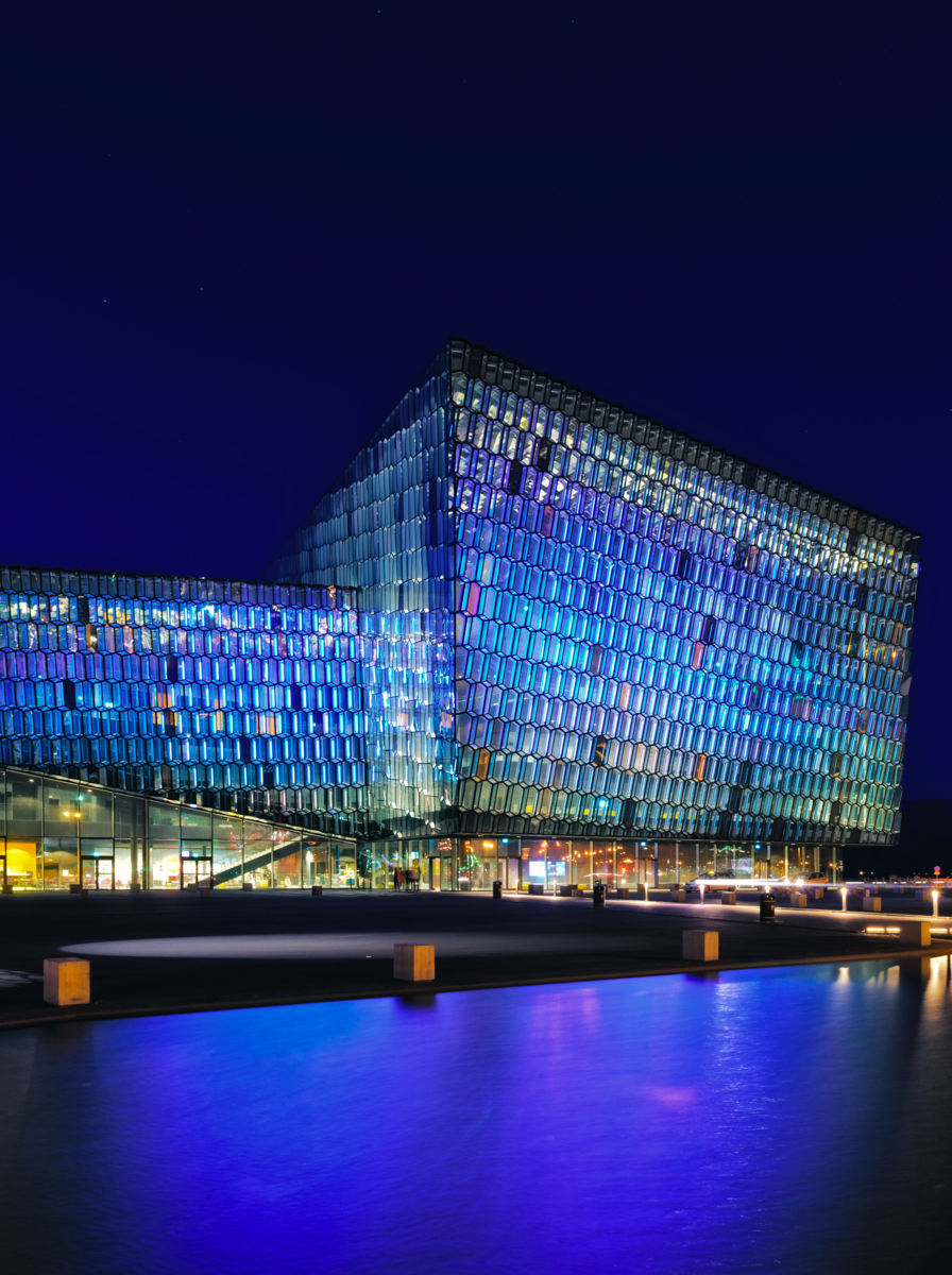 The Harpa concert Hall also known as the Reykjavik Opera House is illuminated at night. Image taken from the promenade road