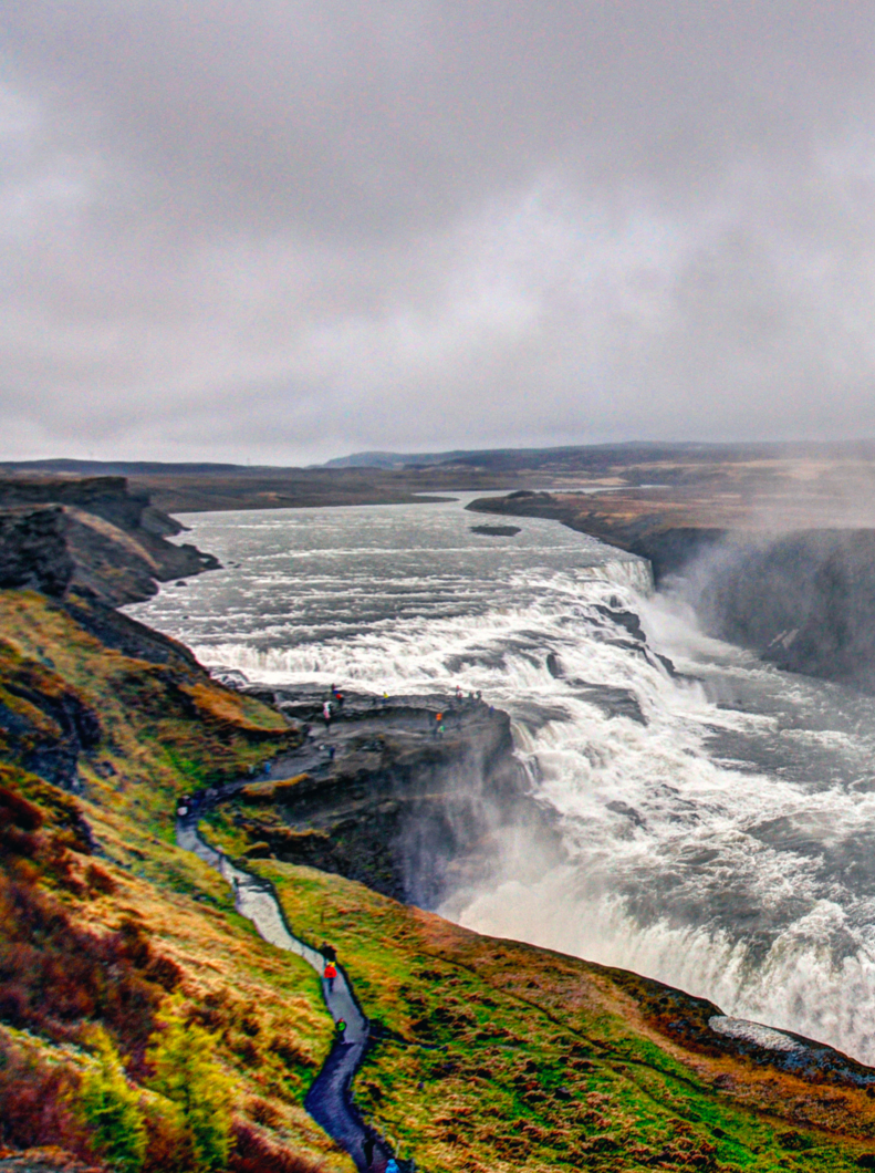 Overlook of Gullfoss Falls showing walkway along edge. Edited to highlight colors