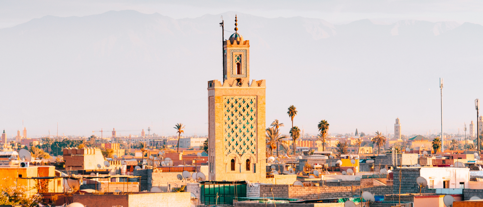 panoramic views of Marrakech old Medina city with Atlas Mountains at background