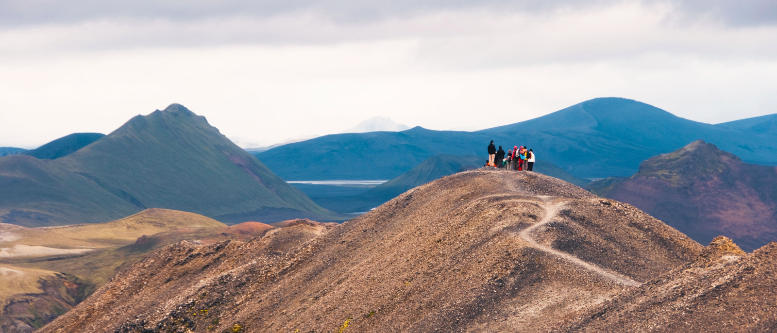 A group of people on a mountain at Landmannalaugar in Iceland