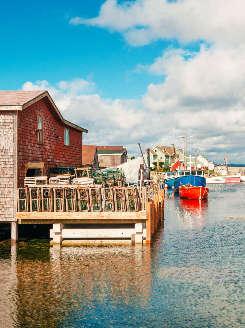 Picturesque houses and fishing boats in Peggys Cove village, Nova Scotia