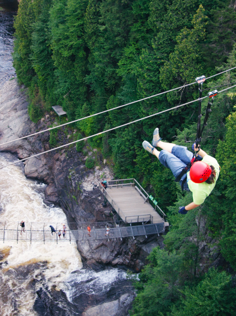 Woman on a Safety Cable/Zip Line Adventure tour
