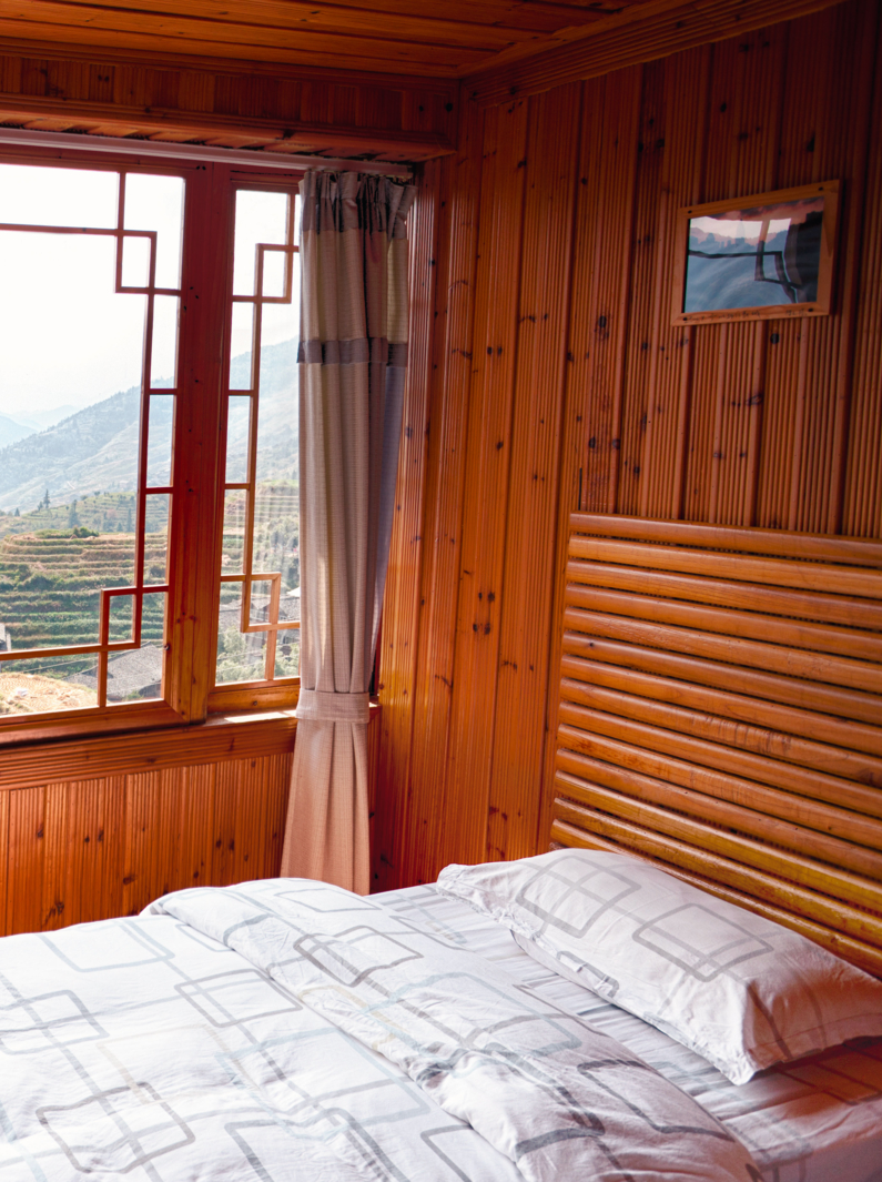 Wooden interior of a hotel room with a spectacular rice terrace view in China