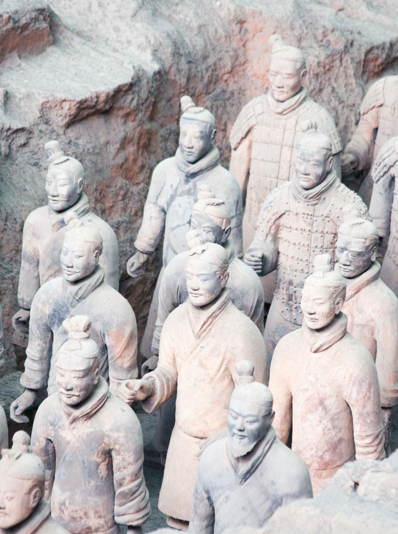 Famous Terracotta Army in Xi'an, China. The mausoleum of Qin Shi Huang, the first Emperor of China contains collection of terracotta sculptures of armored men and horses.