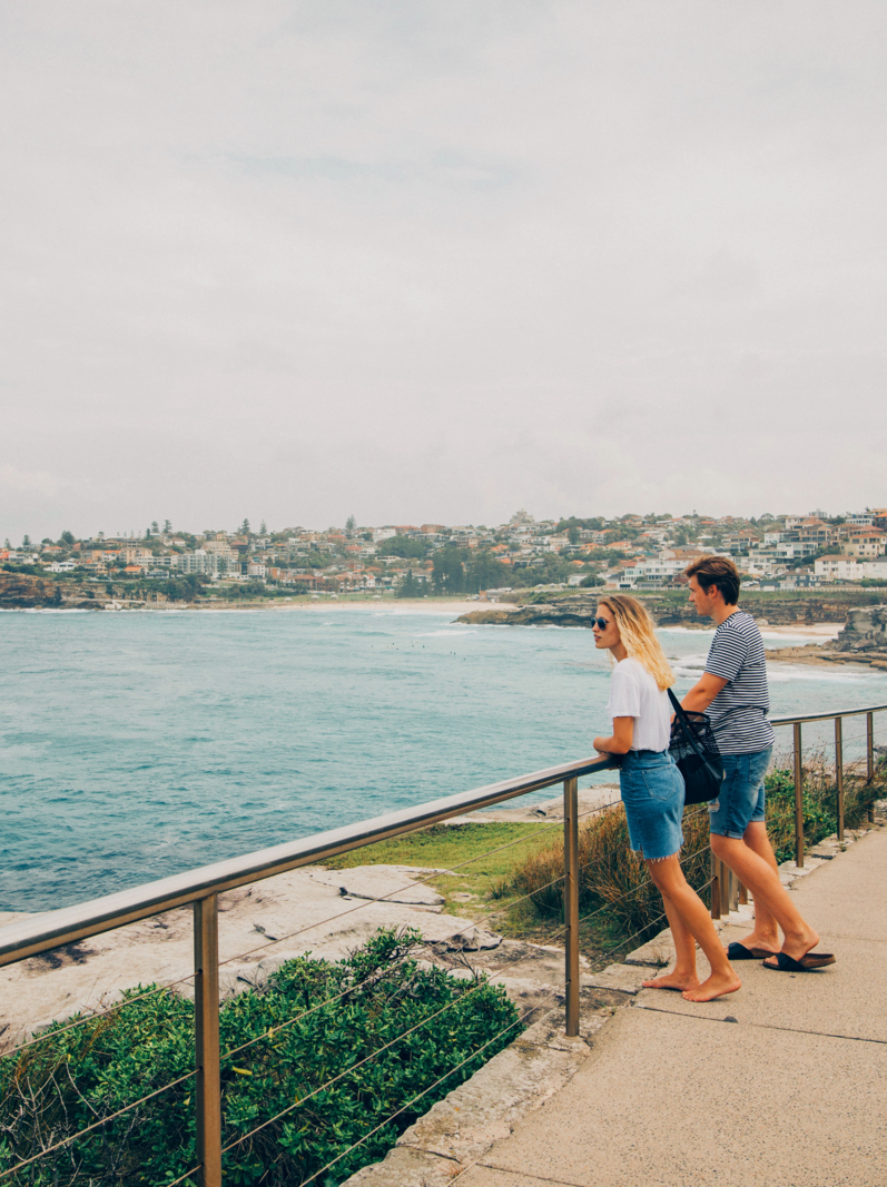 A young couple admire the view at Bondi Beach.
