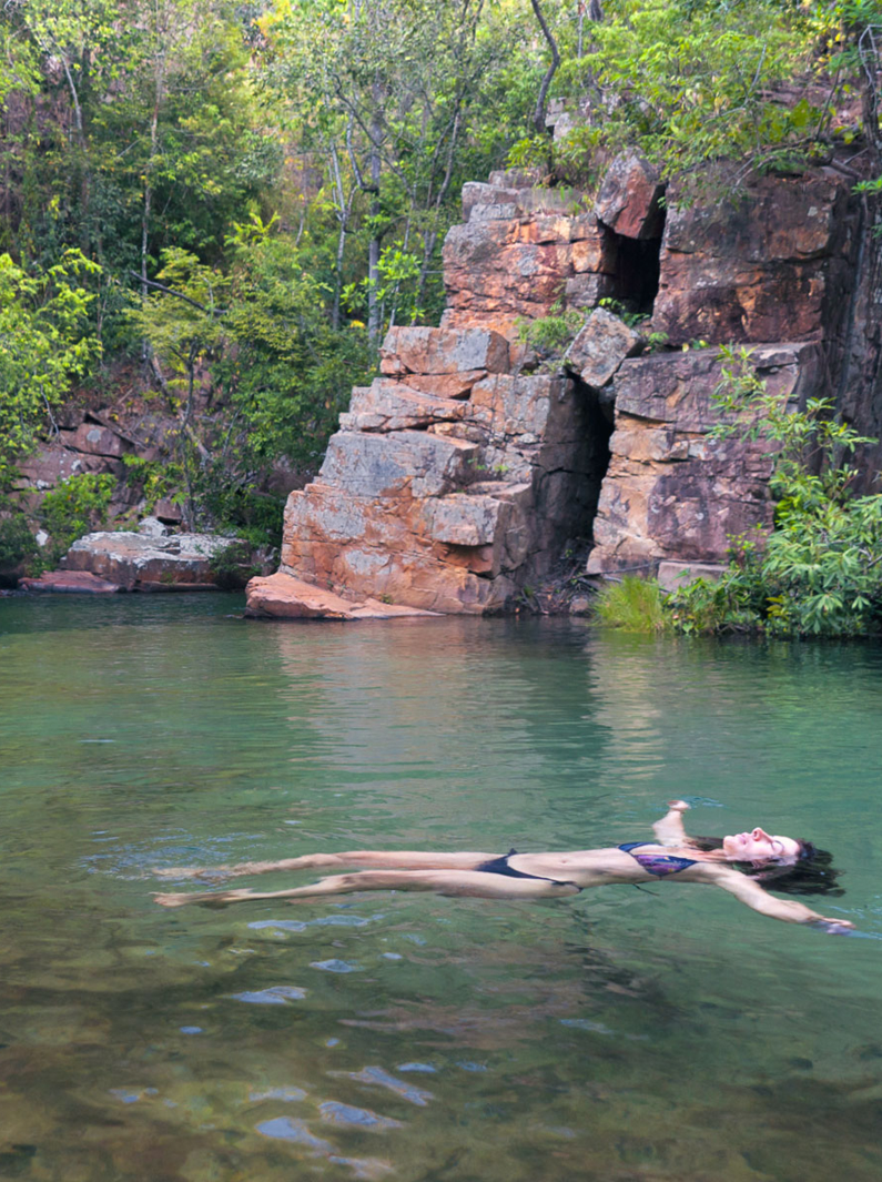 Woman floating in the lake of a waterfall in the state of Mato Grosso in west central Brazil
