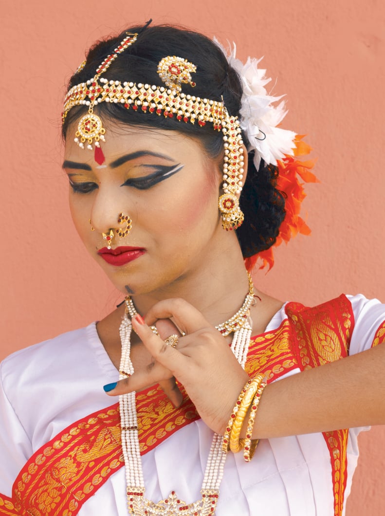 Indian classical dancer in traditional dress performing kathakali dance