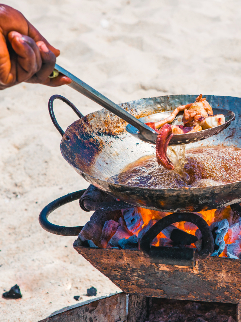 Cooking sea food on beach. Zanzibar, Tanzania.