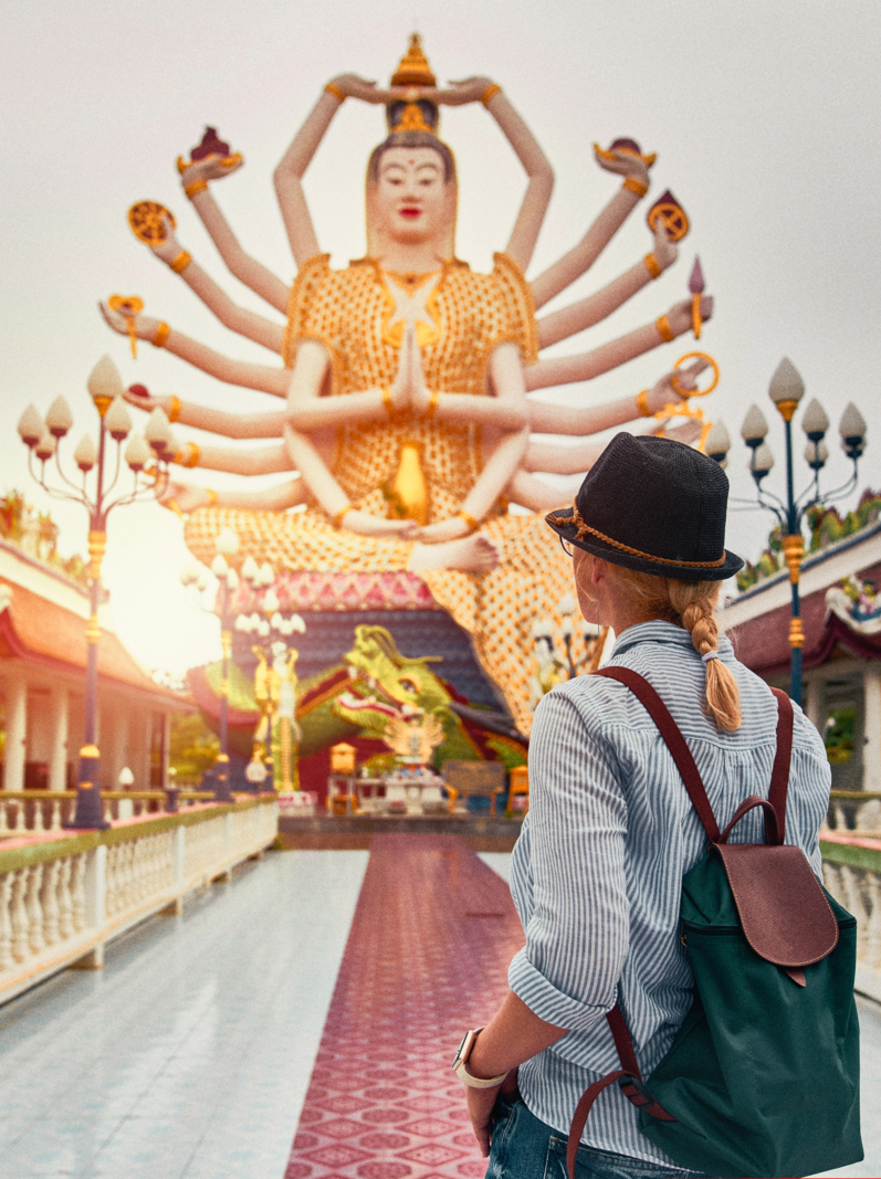European Tourist Visiting Asian Temple. Wat Plai Laem. Statue of the goddess Guanyin. Koh Samui. Thailand