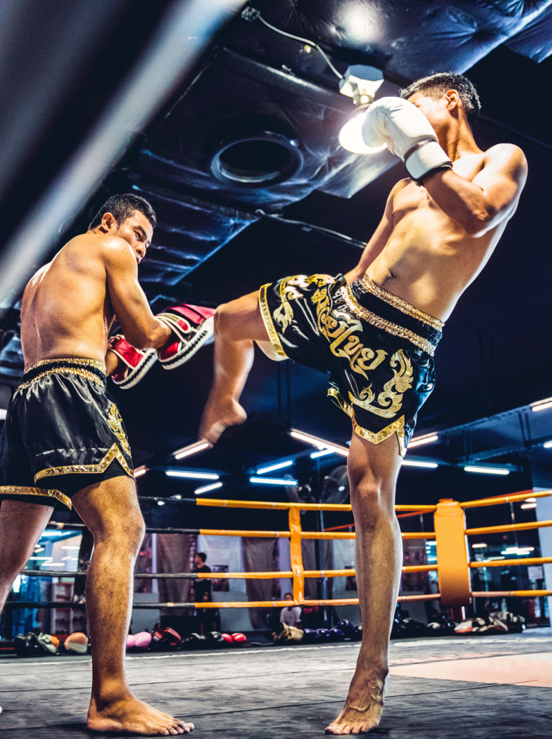 Muay Thai athletes training on the boxing ring