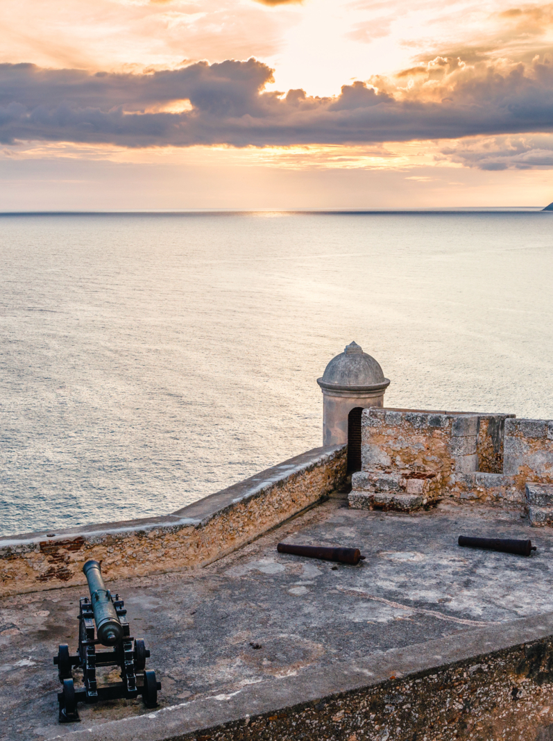 San Pedro de La Roca fort walls with canon, Caribbean sea sunset view, Santiago De Cuba, Cuba