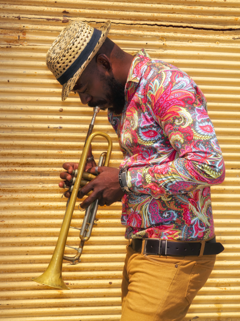 African musician playing a trumpet in Havana, Cuba.